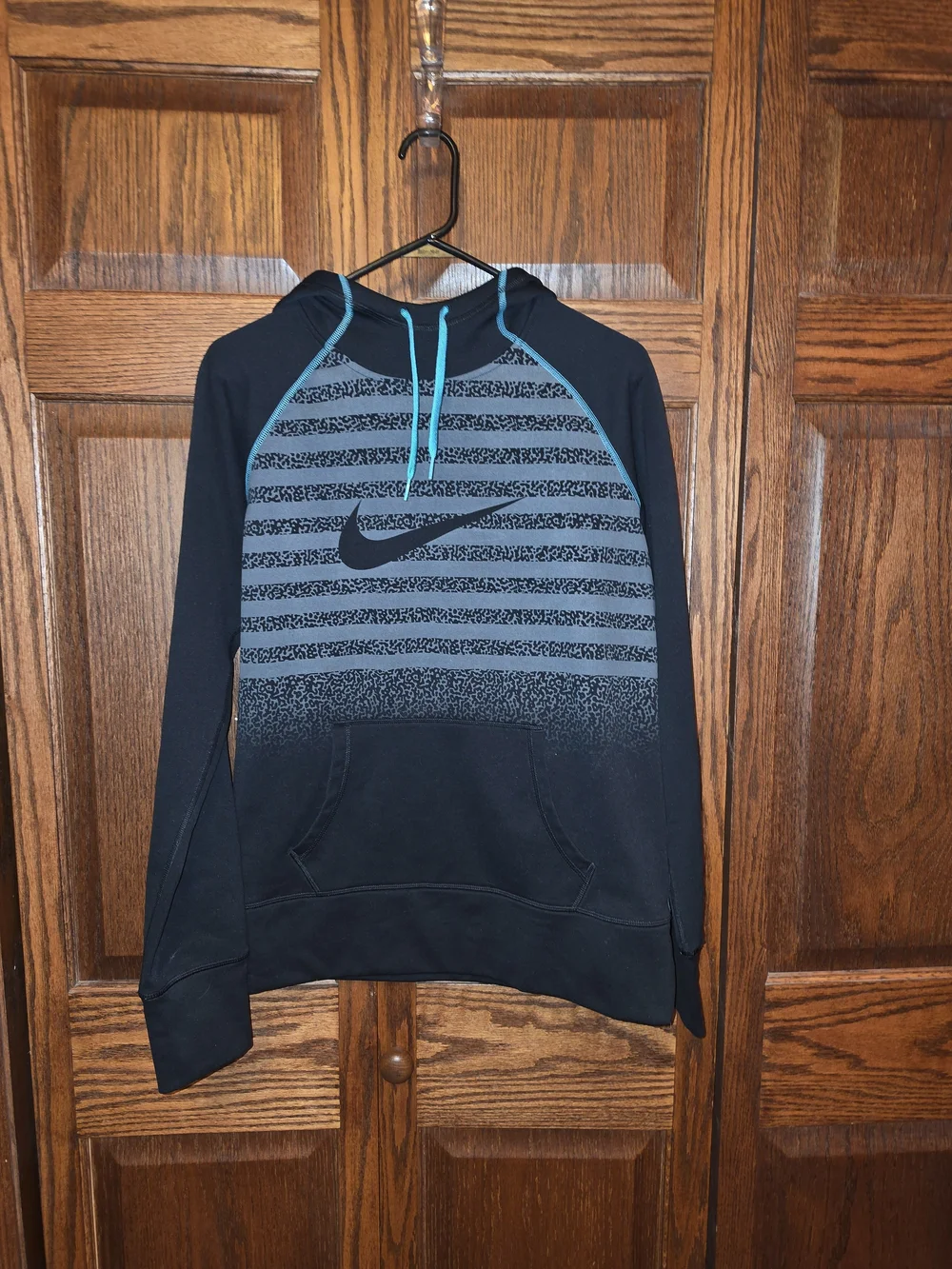 Nike Black Hoodie with Teal Accents and Striped Front